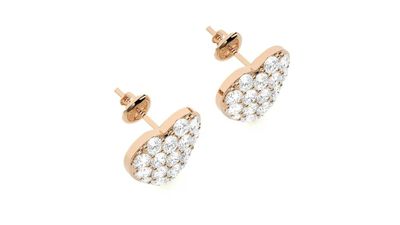 a pair of diamond stud earrings in rose gold