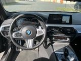 a view of the inside of a car from the driver ' s seat