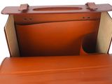 an orange leather briefcase sitting open on top of a white surface