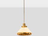 a brass pendant light with a white shade hanging from the ceiling