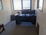 a room with a desk and a chair in it