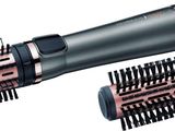 two different types of hair dryers and combs on a white background