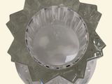 a glass bowl that has a star design on it