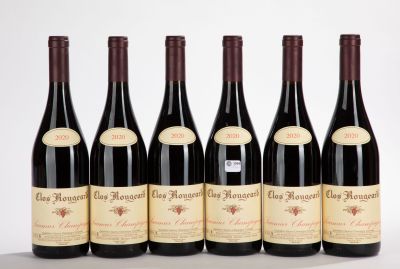 six bottles of red wine are lined up in a row