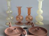 a group of vases that are sitting on a table