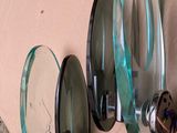 two mirrors that are hanging on the side of a wall