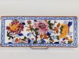 an image of a decorative box with flowers painted on it