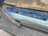 an image of a car door with a piece of wood sticking out of it