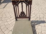 a chair that is sitting in the middle of the street