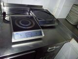 two burners on the stove top in the kitchen