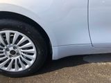a close up of a car ' s tire on the street