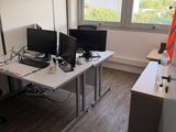 an image of an office with two computer monitors on a desk