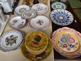 many plates and bowls on a table in a room