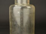an image of a glass beaker with a liquid in it