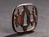 a close up of a metal object with a bird on it