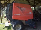 a tractor that is parked under a building