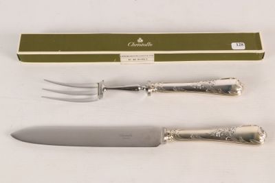 two forks and a knife on a white table