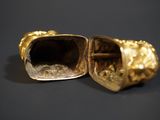 pair of gold - plated figurines of a lion and a lion ' s head