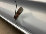 a sticker attached to the side of a car door