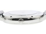 a close up of a watch on a white surface with a white background