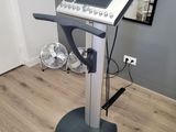 a machine that is sitting on a stand in a room
