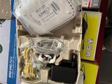 a box with a keyboard, mouse, and other electronics in it