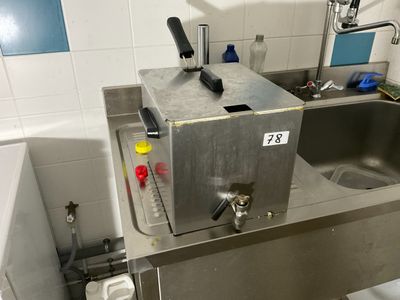 an image of a kitchen with a sink and a faucet