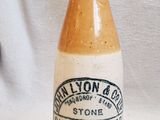 a small bottle with a label on it sitting on a table