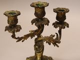 pair of antique brass candlesticks with birds and flowers on them