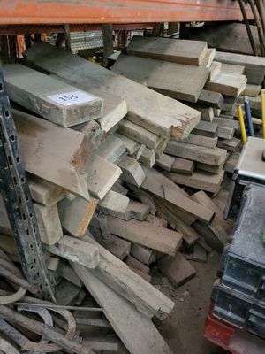 many pieces of wood stacked on top of each other