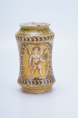 a small vase with a picture of a man on it