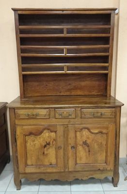 a wooden cabinet with two drawers on top of it