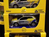 three boxed toy cars are shown on display in a box