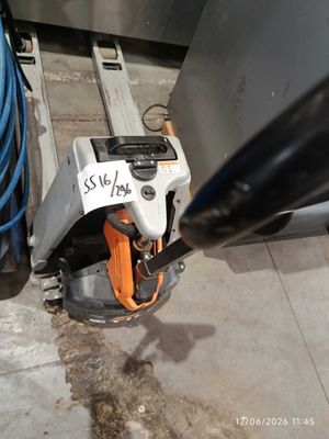 a sign on the side of a machine that is on the ground