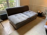 an image of a living room with a couch and a window