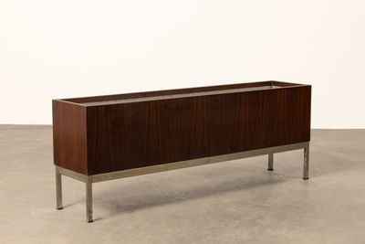 the sideboard is made out of wood and has metal legs
