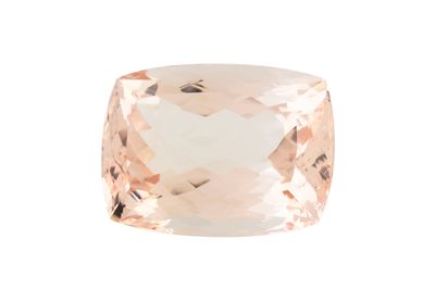 a cushion cut peach quartz gems with a white background