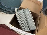 many different types of sanding discs in a box