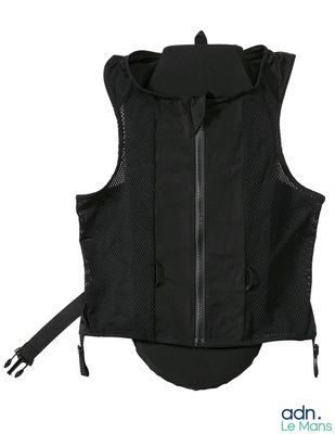 a close up of a black vest with zippers on it