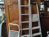 a ladder that is leaning against a cabinet in a room
