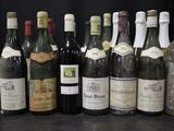 a lot of bottles of wine on the table