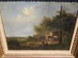 une image d'un tableau sur le mur d'une pièce