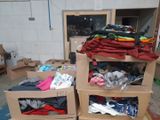 boxes of clothing are stacked on top of each other in a warehouse