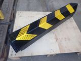a yellow and black hazard hazard strip on a pallet