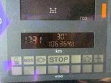 a close up of a digital clock on a bus