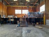 a large room with a lot of wooden floors and a staircase