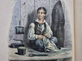 un livre ouvert sur lequel figure l'image d'une femme assise sur une table