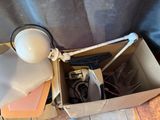 a box that has a lamp and other items in it