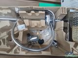 a picture of a box with a faucet and a hose in it