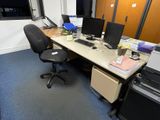 a desk with two computers and a printer on it